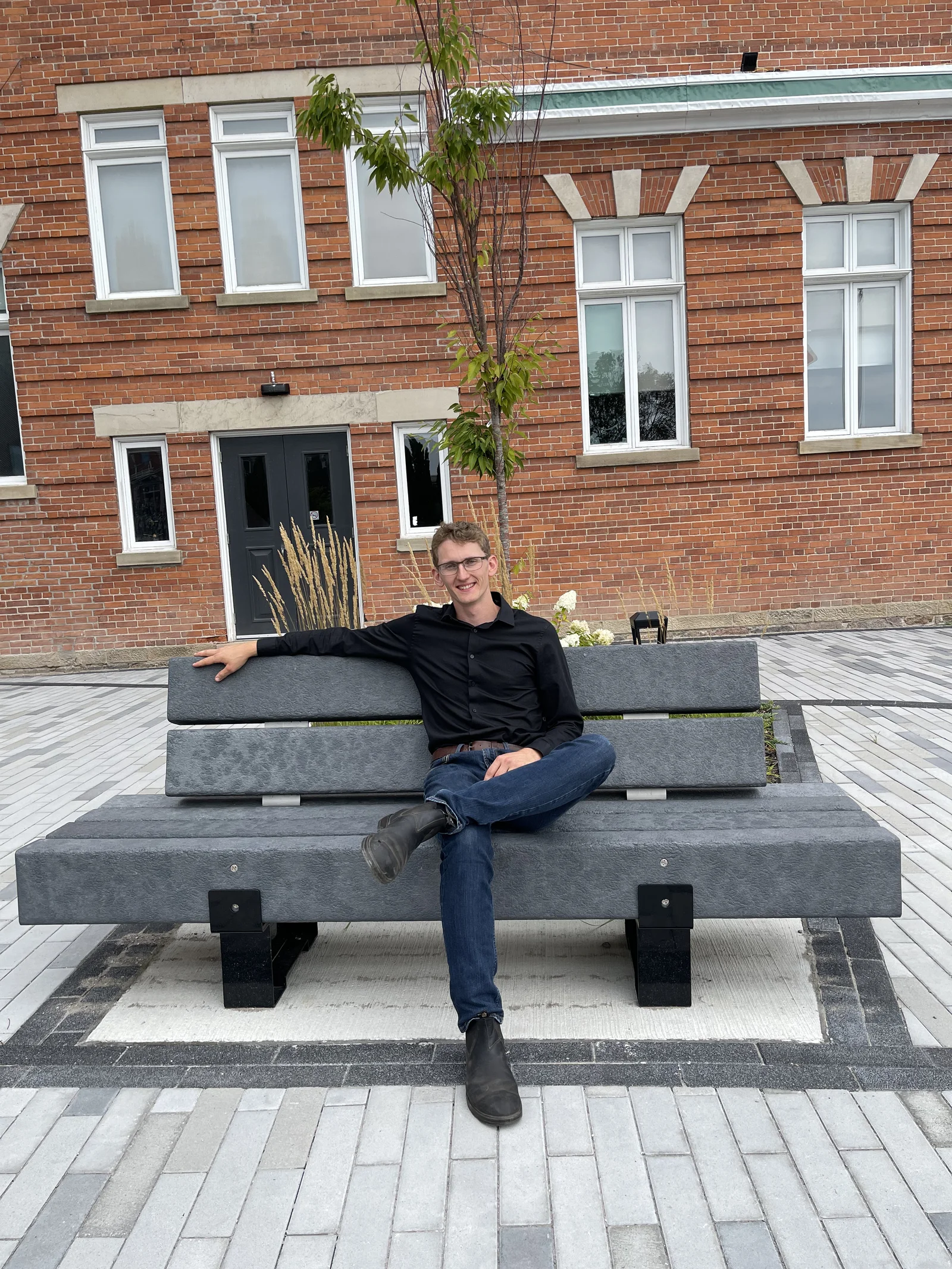 Thomas Zekveld seated on a bench in downtown Bowmanville